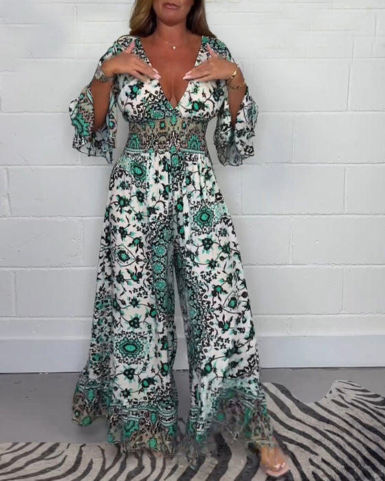 Jumpsuit med trykk og dyp V-hals