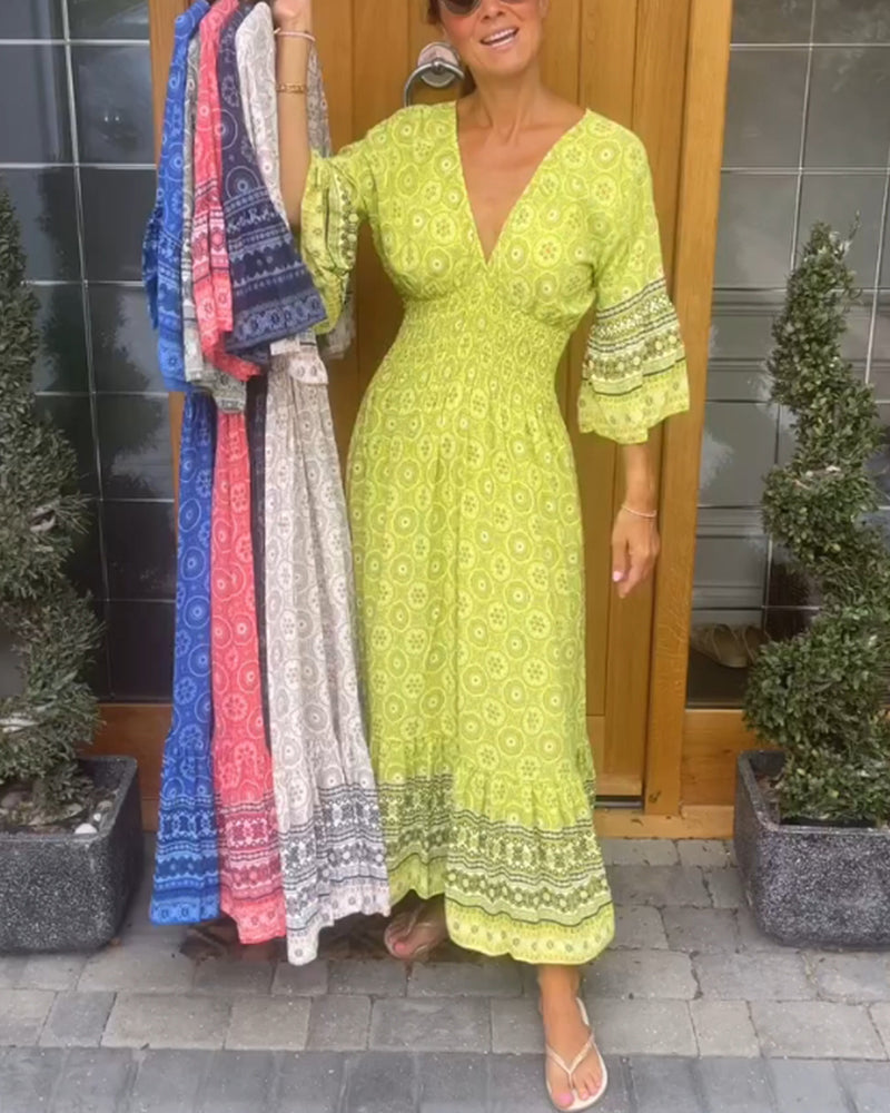 Lang kjole med dyp V-utringning og lange ermer