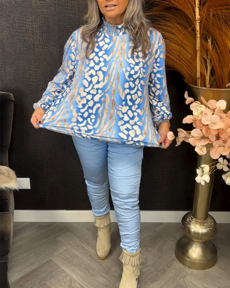 Topp med stativkrage og lange ermer og trykk