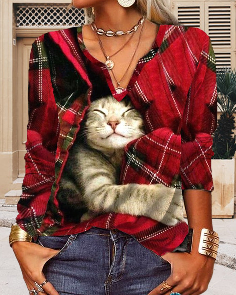 Topp med kattepaneler og lange ermer