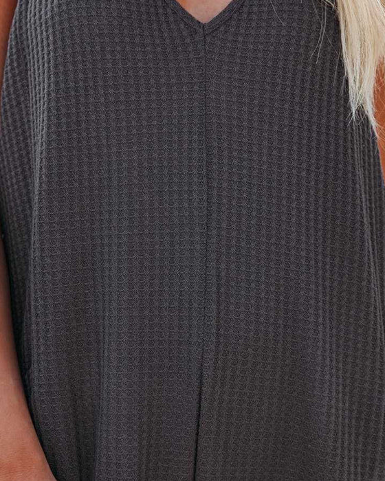 V-hals buksesele i ensfarget med lomme