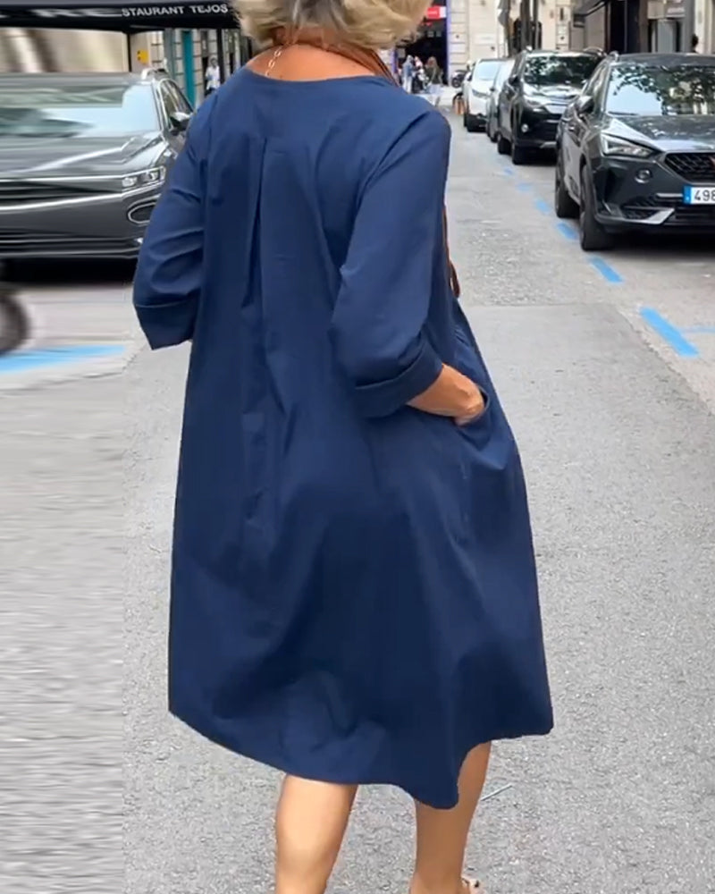 Rund halskjole med lommer