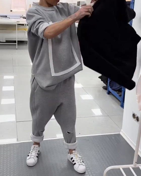 Enkel ensfarget hettegenser