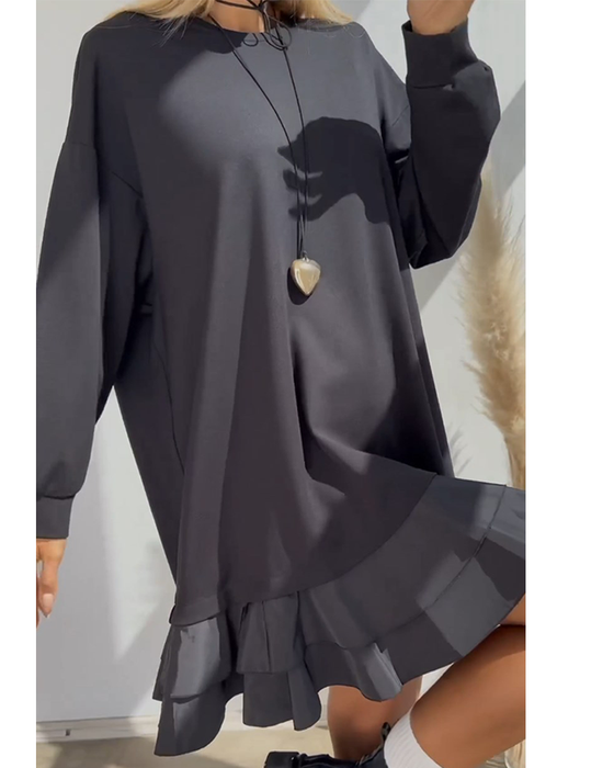 Løs ensfarget kjole med patchwork