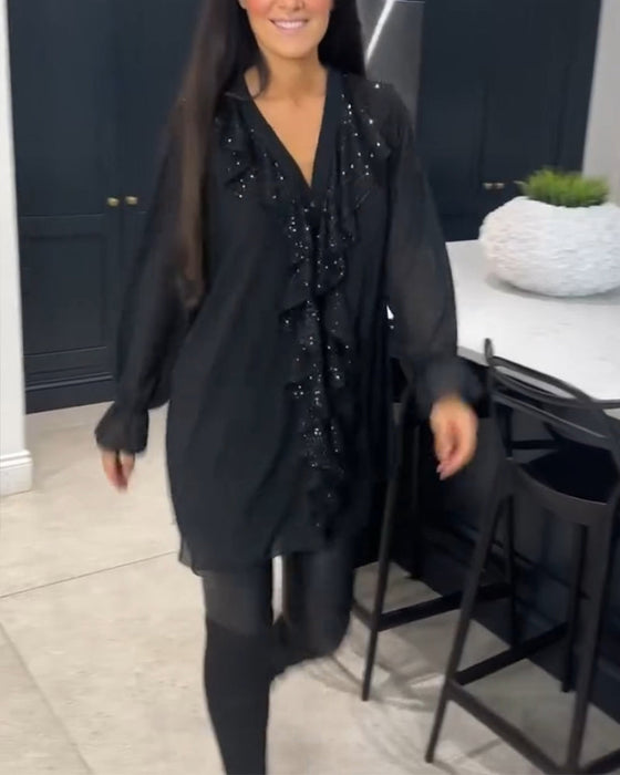 Bluse med volanger og elegant stil