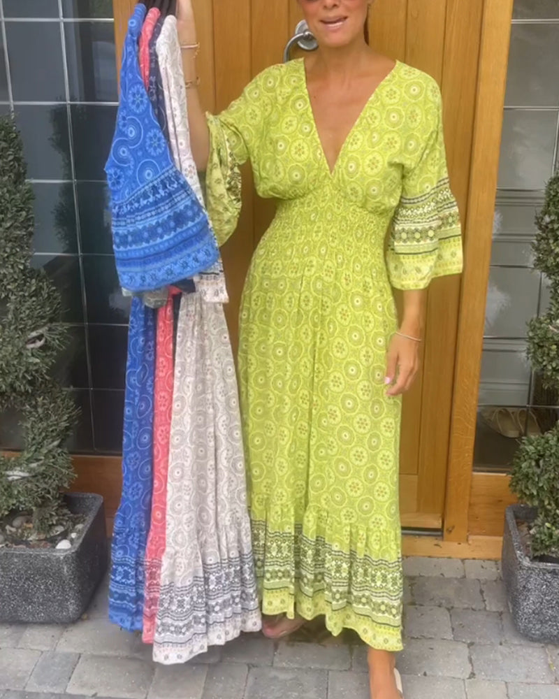 Lang kjole med dyp V-utringning og lange ermer