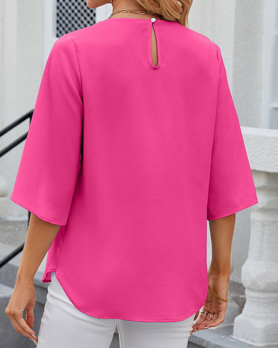Elegant ensfarget bluse med halv erme