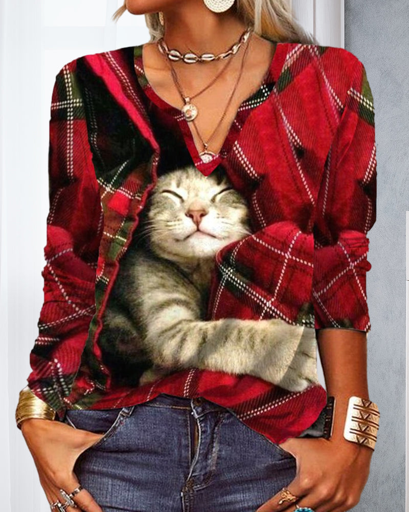 Topp med kattepaneler og lange ermer