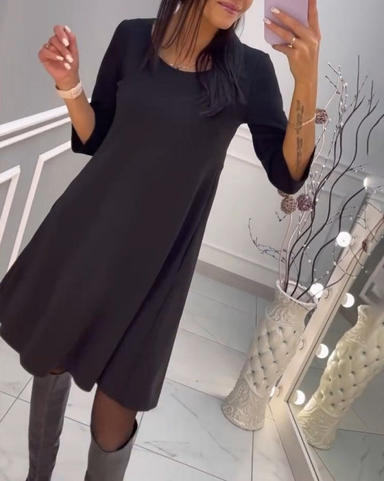 Ensfarget kjole med sløyfe bak