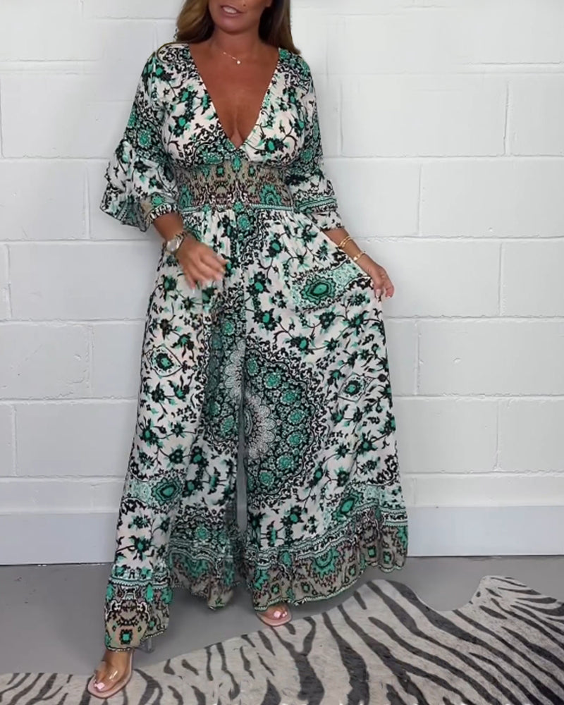 Jumpsuit med trykk og dyp V-hals