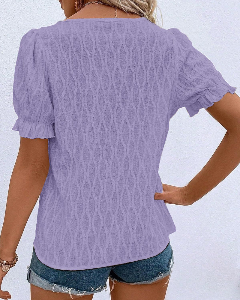 V-hals puffermet ensfarget topp