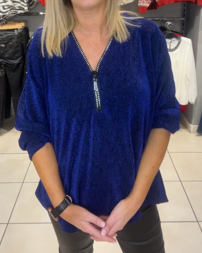 Løs topp med lange ermer og glidelås